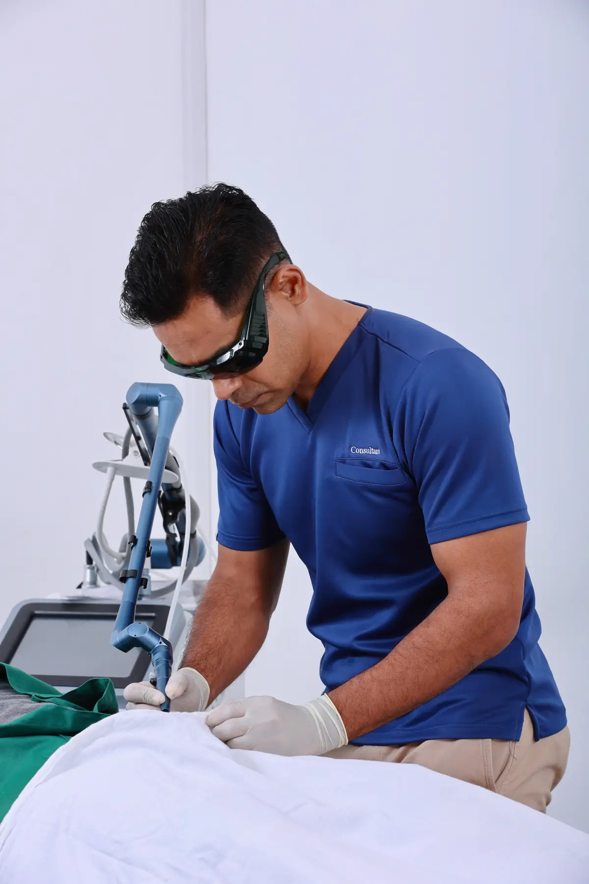 Dr. Prageeth Premadasa performing a clinical procedure