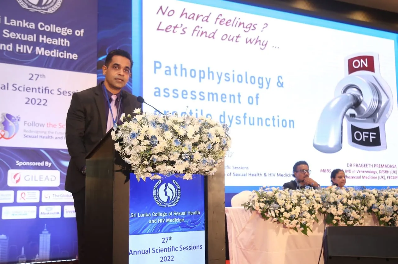 Dr. Prageeth presenting at a conference podium.